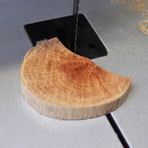 Cut the wooden necklace pendant to shape