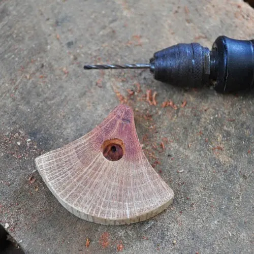 Drill fastener holes in pendant