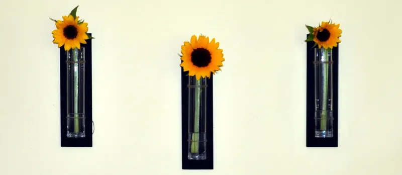 Hanging vases with sun flowers